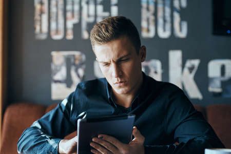 man with tablet in cafe.の写真素材