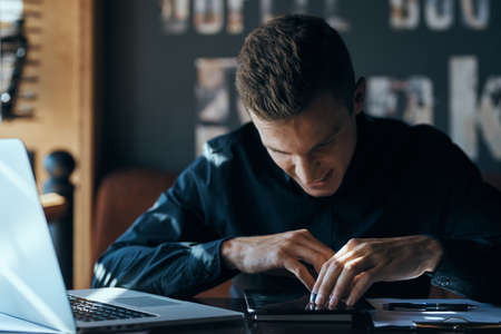 the man lowered his head, emotions, tablet, cafe.の写真素材