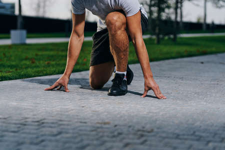 man in a position for running on the street.の写真素材