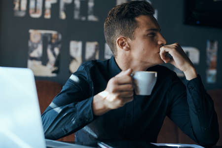 man, looking away, mug, cafe.の写真素材