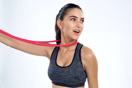 Athletic girl with a rope around her neck.の写真素材