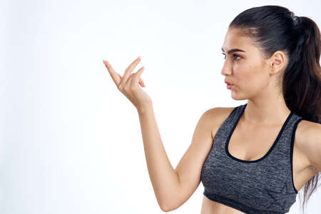 sports girl points to empty space.の写真素材