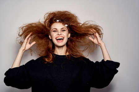 shaggy girl is happy to put on a light background.の写真素材