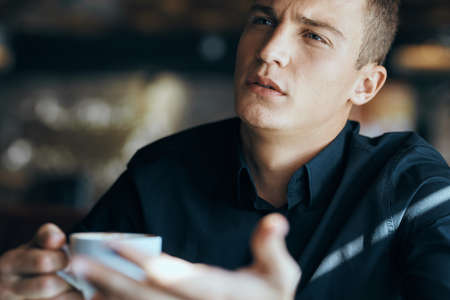 man with coffee close-up.