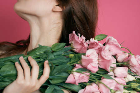 bunch of flowers, girl's neck, brown hair.の写真素材