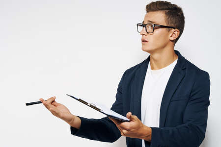 a man in a jacket proposes to sign a contract.の写真素材