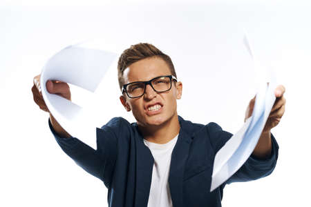 business man offers sheets of paper with a serious look.の写真素材