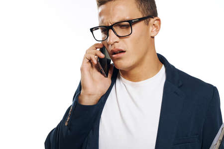 business man in a suit talking on the phone.の写真素材