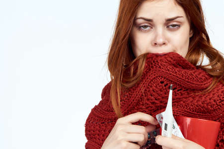 the girl is very sick and bites her scarf.