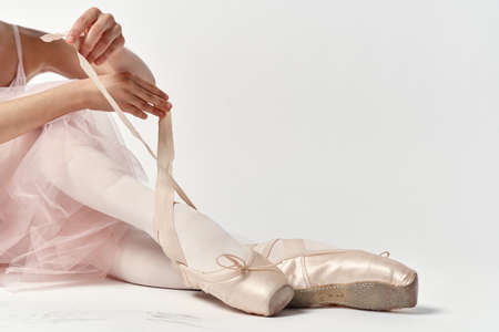 Hands and crocheted ballet dancers close-ups.の写真素材