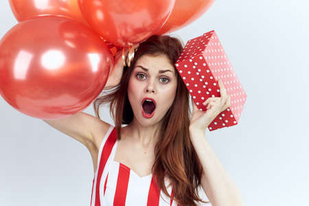 a woman is shocked at a lot of gifts.の写真素材