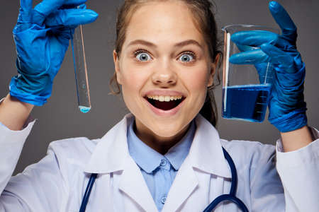 girl doctor with test tubes very happy.の写真素材