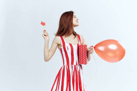 woman enjoys the day of the holy valentine on a white isolated background.の写真素材