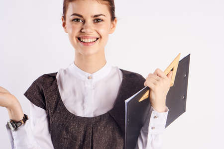 woman teacher with tablet in hand smiling.の写真素材