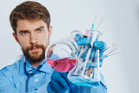 bearded man doctor with a huge number of tubes.