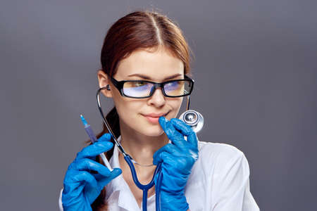 beautiful female doctor with interest looks at the patient.の写真素材