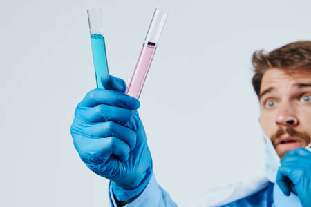 male doctor, test tubes, close-up.