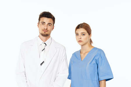 A woman and a man doctor in a medical suitの写真素材