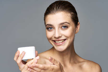 Beautiful woman with a bath of cream.の写真素材