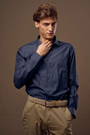 Handsome young male model in a stylish suit posingの写真素材