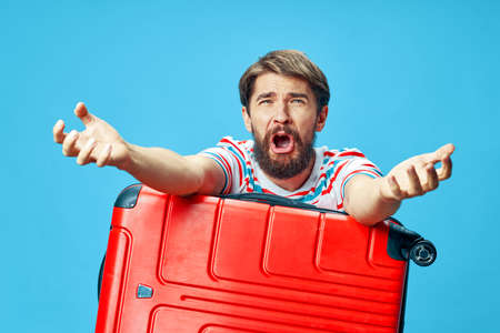 emotional man red suitcase passengerの写真素材