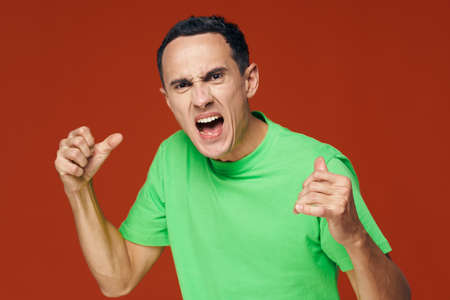 Emotional man gesticulating with his handsの写真素材