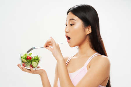 Beautiful woman of Asian appearance salad dietの写真素材