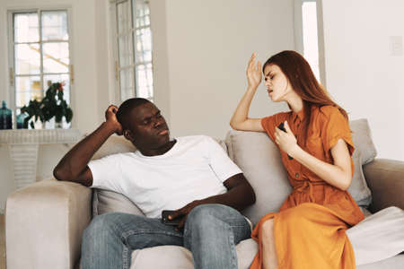 Need or chat sofa room family man African appearanceの写真素材