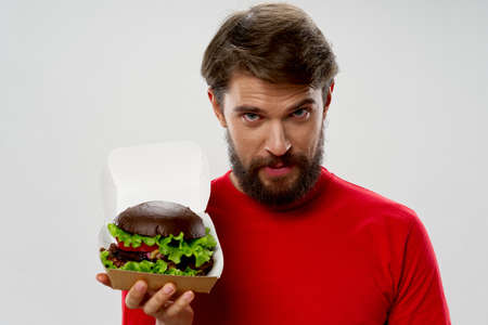 Bearded man hamburger diet food delicacy gourmetの写真素材