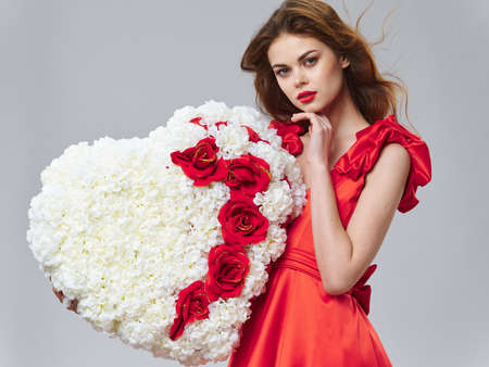 Heart made of flowers beautiful woman red dress bright makeup model