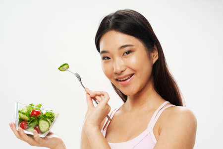Slender girl calorie diet fruits-vegetables modelの写真素材