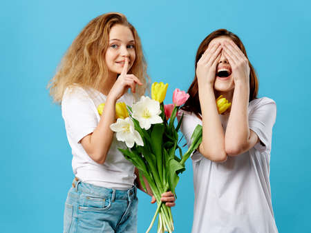 The girl wants to secretly give her mother a bouquet of flowers