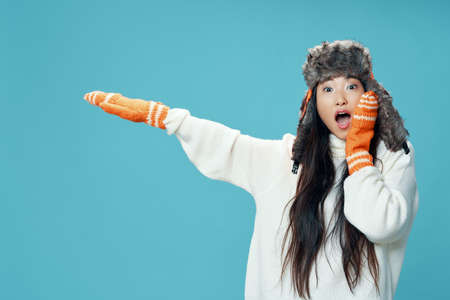 beautiful girl with an Asian appearance looks away and opens her mouth wide.の写真素材