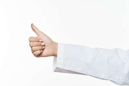Doctor shows thumb positive gesture success model