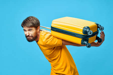 male traveler with a suitcase on his back gravity modelの写真素材