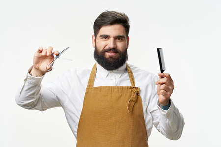 A man with a beard comb scissors barber shop