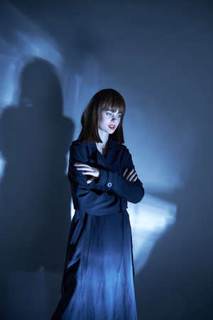 model cloak gloomy look neon color and beautiful face