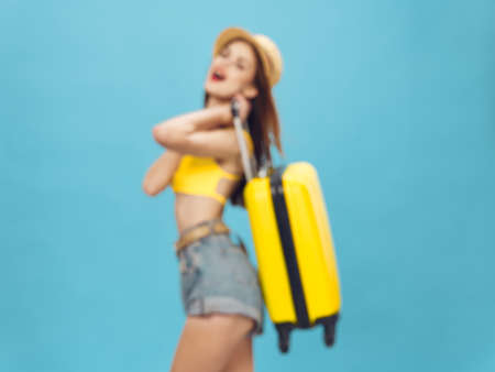 Woman yellow suitcase on vacation travel trip tourism