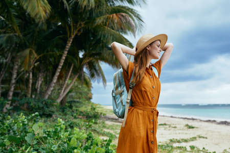Tourist with backpack beautiful woman on the islandの写真素材