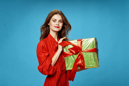 Gift in woman hands Christmas holiday fun Red robe