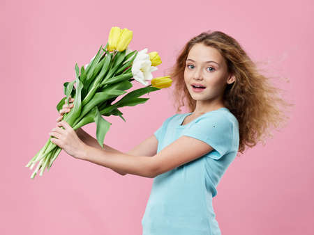 Girl with bouquet of flowers tulips holiday gift birthday