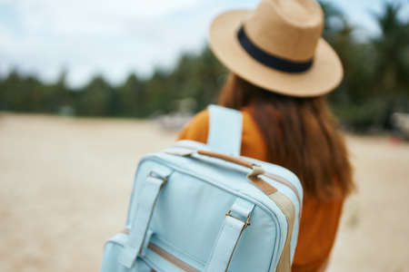 travel tourism woman with backpack hat