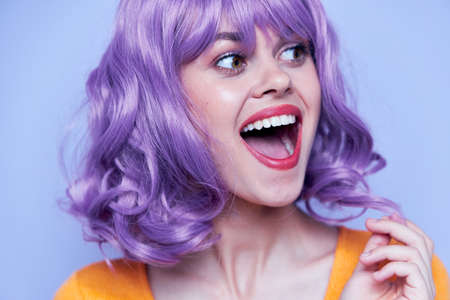 Attractive and smiling model purple hair discoの写真素材