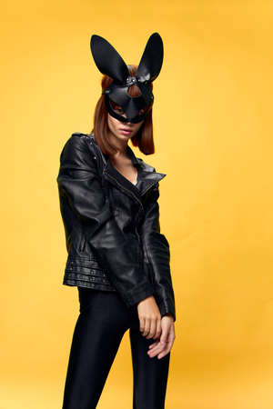 Sexy woman in rabbit mask and black suit, temptationの写真素材