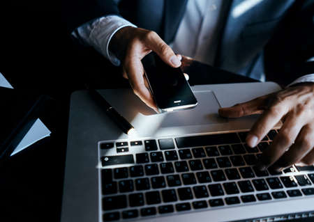 Business man with phone in hand laptop technology communication lifestyle