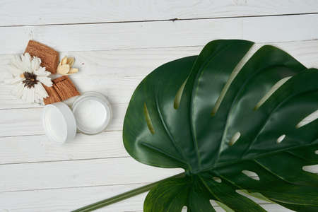 Wooden decorative background green leaf cosmetics for soap bathroom accessoriesの写真素材