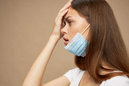 a girl with a medical mask on her face