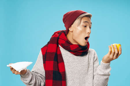 Man in plaid scarf cold lemon headache healthの写真素材