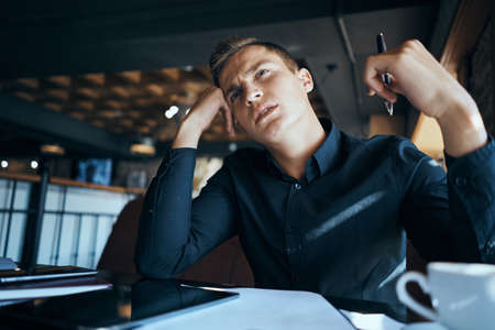 Business man freelancer working in a cafe laptops communication phone room manager modelの写真素材