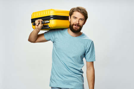 man with yellow suitcase vacation travel vacation tourism summerの写真素材